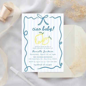 May include: A blue and white striped baby shower invitation with a blue ribbon and the text "ciao baby!" in blue. Two yellow lemons are illustrated on the invitation. The text "Danielle Jackson" is printed in blue. The invitation includes the date, time, and location of the baby shower. The text "registered at amazon" is printed in blue.
