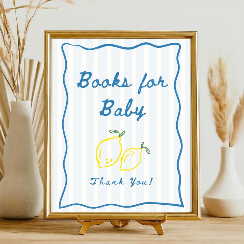 K&ouml;nnte beinhalten: Gerahmtes Schild mit dem Text "Books for Baby" in blauer Schrift, mit zwei gelben Zitronen-Illustrationen. Das Schild hat einen blauen, wellenf&ouml;rmigen Rand und einen gestreiften Hintergrund. Die Worte "Thank You!" stehen unten.