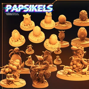 Puede incluir: Una colección de miniaturas de fantasía impresas en 3D de varias formas y tamaños. Las miniaturas son de color beige claro e incluyen formas de huevo, estructuras orgánicas y criaturas. La palabra "PAPSIKELS" se muestra en la parte superior.