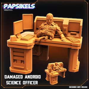 May include: A tan-colored miniature of a damaged android science officer seated at a desk with computer monitors and keyboards. The desk has a matching chair. The text "DAMAGED ANDROID SCIENCE OFFICER" is displayed below the desk.