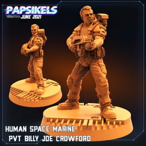 May include: Two tan-colored Human Space Marine figurines, one in front of the other, stand on circular bases. The front figure holds a weapon and wears armor. The text "Papsikels June 2021" and "Human Space Marine PVT Billy Joe Crowford" are visible.