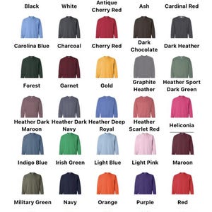 May include: A color chart displaying various sweatshirt color options. The chart includes colors like black, white, red, blue, green, and more, with each color labeled. The text "All Available Color Options" is at the top.
