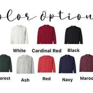 May include: Image displaying a variety of crewneck sweatshirts in different colors. The available colors are white, cardinal red, black, forest green, ash, red, navy, and maroon. The text "Color Options" is written in cursive at the top.