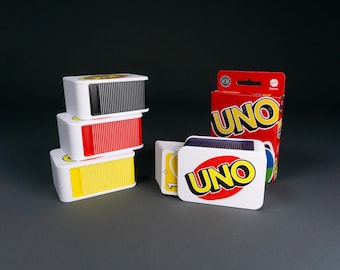 Caja para cartas UNO y sus variantes Flip!, Extreme, Party, Bingo y Show 'em No Mercy. Protección perfecta para guardarlo y viajar.