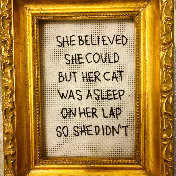 She believed she could but her cat was asleep on her lap so she didn't - (unframed) 4x6 hand embroidery made to order