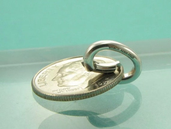 Vintage Tiffany & CO Sterling Silver Oval Clasping Charm Vintage Tiffany & CO Sterling Silver Oval Clasping Charm