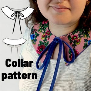 May include: A floral collar pattern with a pink background and a blue velvet tie. The collar is adorned with a colorful floral pattern. The image also shows a diagram of a collar.