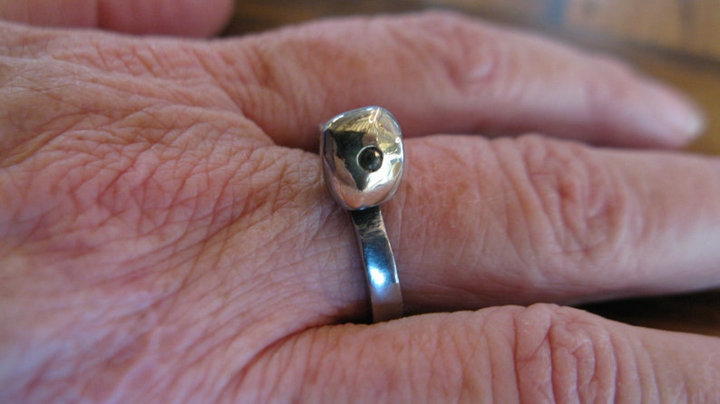 Old steel nail ring with gold capped head and solitaire diamond
