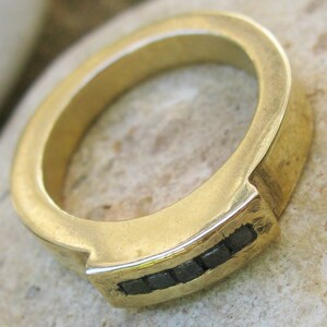 Five black diamonds in the rough on gold ring image 2