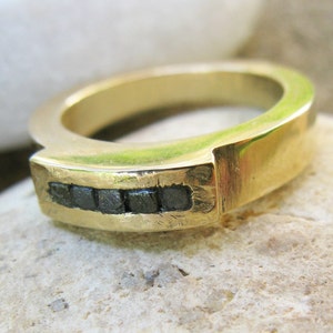 Five black diamonds in the rough on gold ring image 1