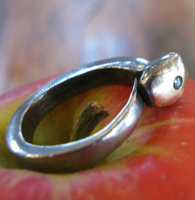 Old steel nail ring with gold capped head and solitaire diamond