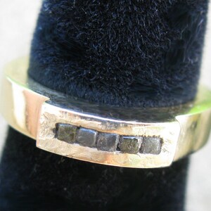 Five black diamonds in the rough on gold ring image 3