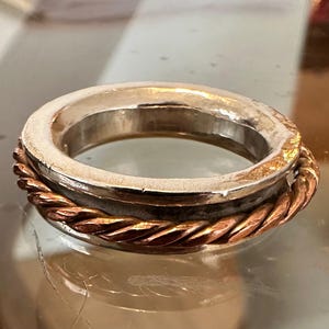Anticlastic silver Spinner Ring with mobile copper inner ring