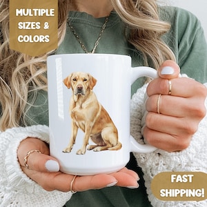 May include: White ceramic mug with a watercolor illustration of a yellow Labrador Retriever sitting. The mug has a large handle.