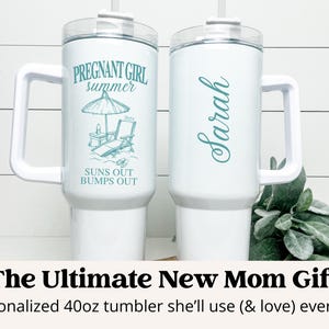 May include: Two white 40 ounce tumblers with lids and handles. One tumbler has the text "PREGNANT GIRL summer SUNS OUT BUMPS OUT" and the other tumbler has the name "Sarah" written on it.
