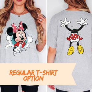 The image is a collage of two photos. In the left photo, a woman is wearing a gray t-shirt with a Minnie Mouse design on the front. In the right photo, the same woman is wearing a gray t-shirt with a Minnie Mouse design on the back. The text below the images reads "REGULAR T-SHIRT OPTION".