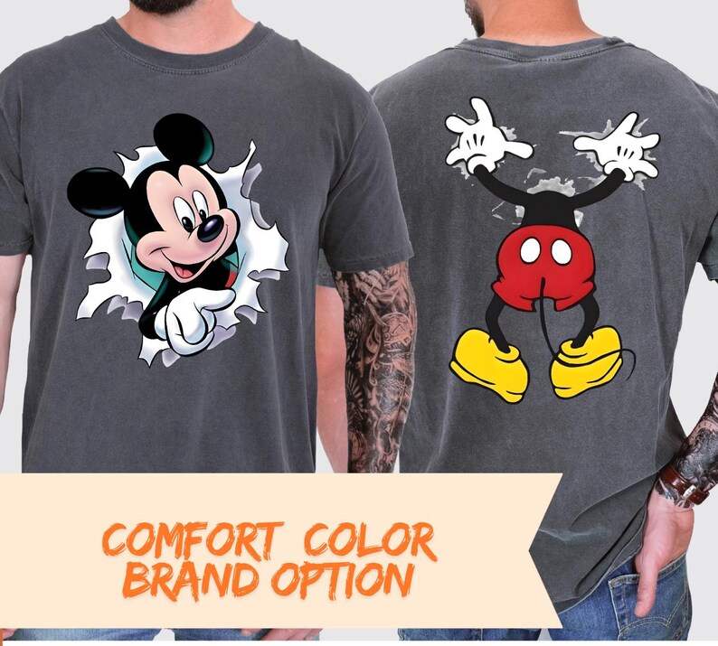 two men wearing t-shirts with Mickey Mouse designs.