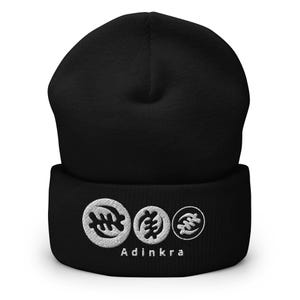May include: Black beanie with a white embroidered Adinkra symbol and the word "Adinkra" on the cuff.