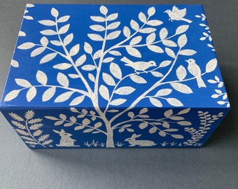 Hand-painted wooden jewelry box, with decorations of rabbits, trees, and birds