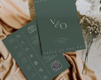May include: Two dark green wedding order of the day cards with white text and icons. The cards feature the text "ORDER OF THE DAY" and the initials "V & O". One card includes a QR code and wedding details.