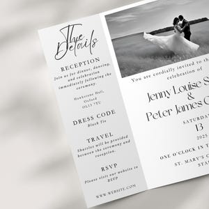 A gatefold wedding invitation on a neutral background