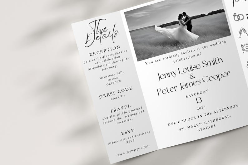 A gatefold wedding invitation on a neutral background