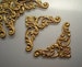 6 small brass floral corner brackets, No. 1 