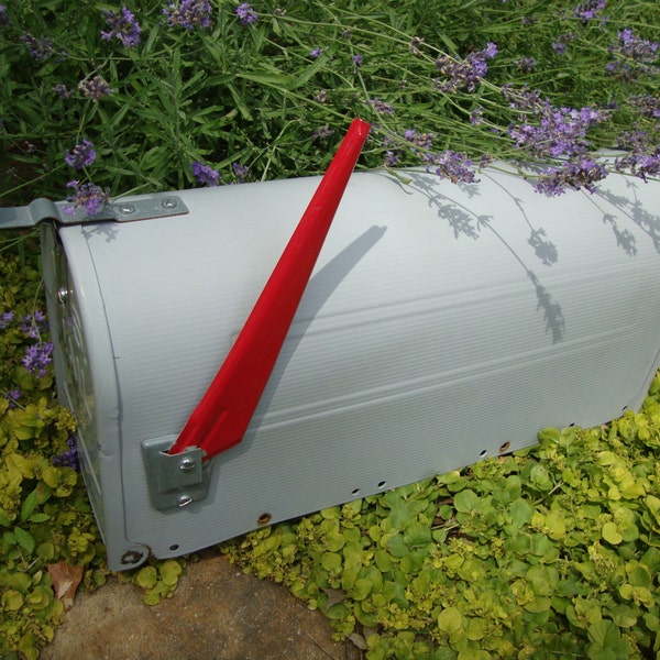 large vintage farm metal mailbox with red flag