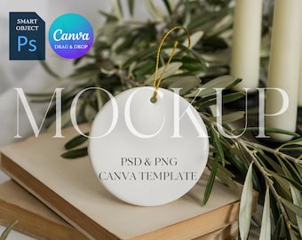 May include: A white ceramic ornament with a gold string, featuring the text "PSD & PNG CANVA TEMPLATE". The ornament is placed on a stack of old books, with olive branches and candles in the background. The image also includes the Canva and Photoshop logos.