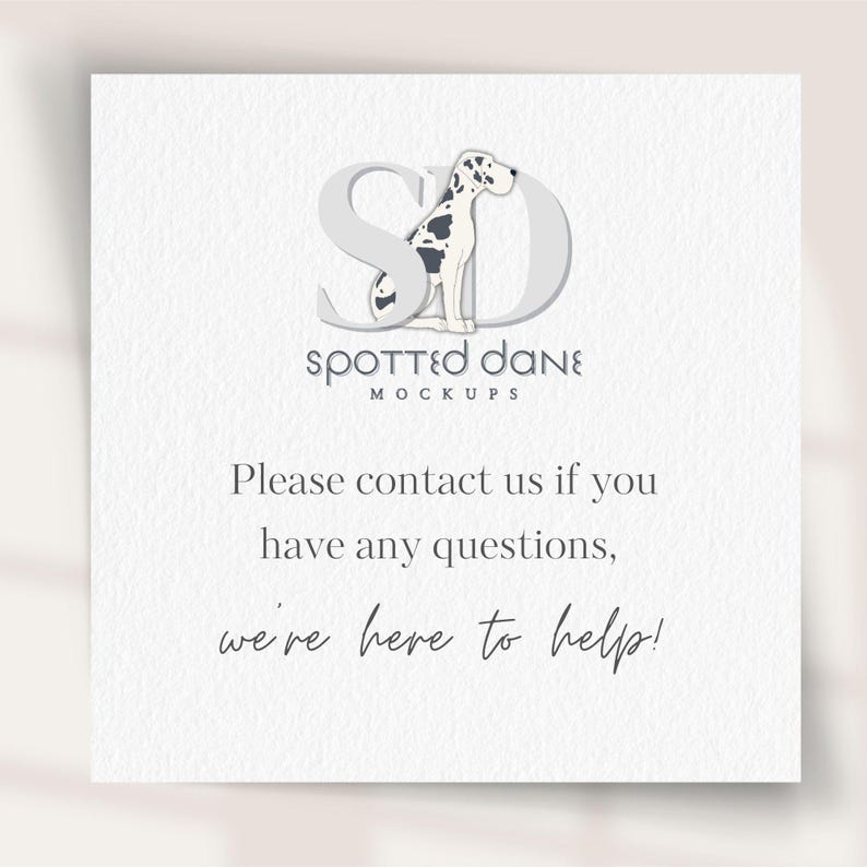 a white card with a black and white dog on it