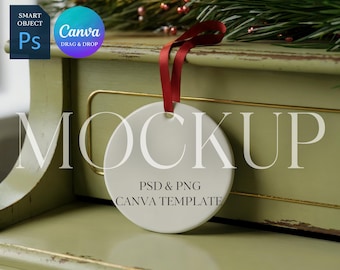May include: A white, round ornament with a red ribbon, hanging against a green background. The ornament has the word "MOCKUP" in large letters, with "PSD & PNG CANVA TEMPLATE" below. A "Canva" logo is visible.