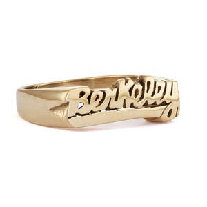 May include: A gold ring with the word "Berkeley" engraved in a stylized font.