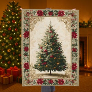 May include: A festive Christmas blanket with a detailed illustration of a decorated Christmas tree. The blanket has a cream background with a border of red poinsettias and gold accents. The tree is decorated with red bows and gold baubles.