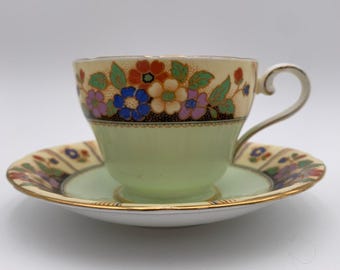 Aynsley tekopp med fat i benporslin C591/2 – Blommor, guldkant, England Vintage