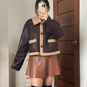 Women’s Winter Sheepskin Jacket, B3 Aviator Leather Bomber, 70s Vintage Style Coat, Brown Shearling Jacket, Cozy Fur Collar Flight Coat, Retro Leather Bomber Women, Authentic B3 Sheepskin Jacket, Women’s Classic Flight Outerwear, Handmade Winter Shearling, Warm Brown Bomber Coat, Soft Fur Lined Jacket, Retro 1970s Leather Jacket, Timeless Sheepskin Fashion, Vintage Leather Pilot Jacket, Stylish Cold Weather Coat, Women’s Real Leather Jacket, Flight Style Bomber, Elegant Brown Shearling