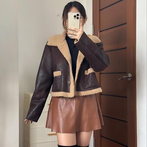 Retro Shearling Aviator Jacket, B3 Flight Bomber Coat, Sheepskin Leather Jacket Women, Fur Lined Vintage Bomber, Classic B3 Jacket for Women, Brown Shearling Coat, Warm Fur Collar Coat, 70s Flight Fashion, Stylish Pilot Jacket Women, Cozy Sheepskin Bomber, Retro Winter Outerwear, Brown Leather Shearling Jacket, Timeless Vintage Style Jacket, Warm Lined Leather Bomber, Elegant Women’s Aviator Coat, Brown Bomber for Cold Weather, Premium Leather Flight Jacket, Handmade Fur Jacket