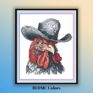 May include: Cross-stitch portrait of a rooster wearing a black cowboy hat. The rooster has red comb and wattle, with a detailed, textured appearance. The image is framed with a blue and pink border, with the text "18 DMC Colors" at the bottom.