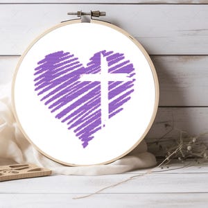 May include: A purple heart with a white cross inside. The heart is made of a series of diagonal lines. The cross is centered in the heart.