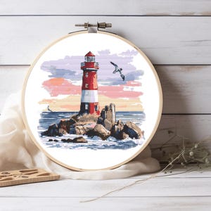 May include: A red and white lighthouse stands on a rocky outcropping in the ocean. The sky is a soft pink and purple, and a seagull flies overhead.