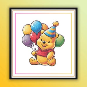 May include: A framed cross-stitch pattern featuring a yellow bear wearing a red shirt and a blue and orange striped party hat. The bear is sitting and holding a cluster of five balloons in yellow, blue, red, purple, and green colors.