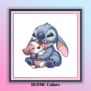 May include: A framed cross-stitch pattern featuring a blue alien character hugging a brown and white dog. The image has a white background with a pink and blue border. The text "18 DMC Colors" is at the bottom.