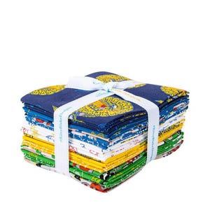 May include: A stack of colorful fabric squares tied with a white ribbon. The fabric features various patterns in blue, yellow, green, and red. The ribbon has text that reads "Riley Blake Designs".