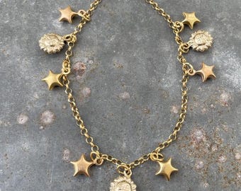 18k gouden bedelarmband met zon- en sterbedels