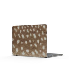 May include: A laptop computer featuring a protective skin with a realistic brown and white spotted deer fur pattern. The device is shown from a rear angle, displaying the textured, animal-inspired print covering the entire outer lid surface.