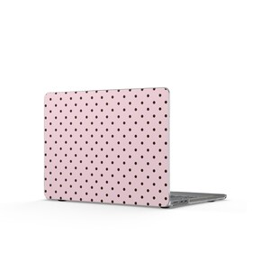 May include: A laptop computer featuring a protective skin or case with a light pink background and a repeating pattern of small, dark brown polka dots. The device is shown from a rear angle, displaying the exterior lid and the metallic hinge area.