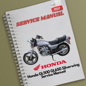 May include: A white spiral bound service manual for a Honda GL500 GL650 Silverwing motorcycle. The cover features a black and white image of the motorcycle and the text "Honda GL500 GL650 Silverwing Service Manual".