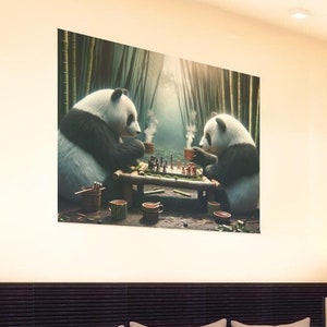 May include: A bedroom with a white bed, two bedside lamps, and a closet. The wall above the bed has a framed print of two pandas playing chess.