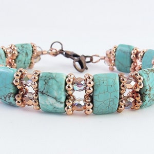 May include: A turquoise and copper beaded bracelet with a silver clasp. The bracelet features turquoise beads with a marbled pattern and copper beads.