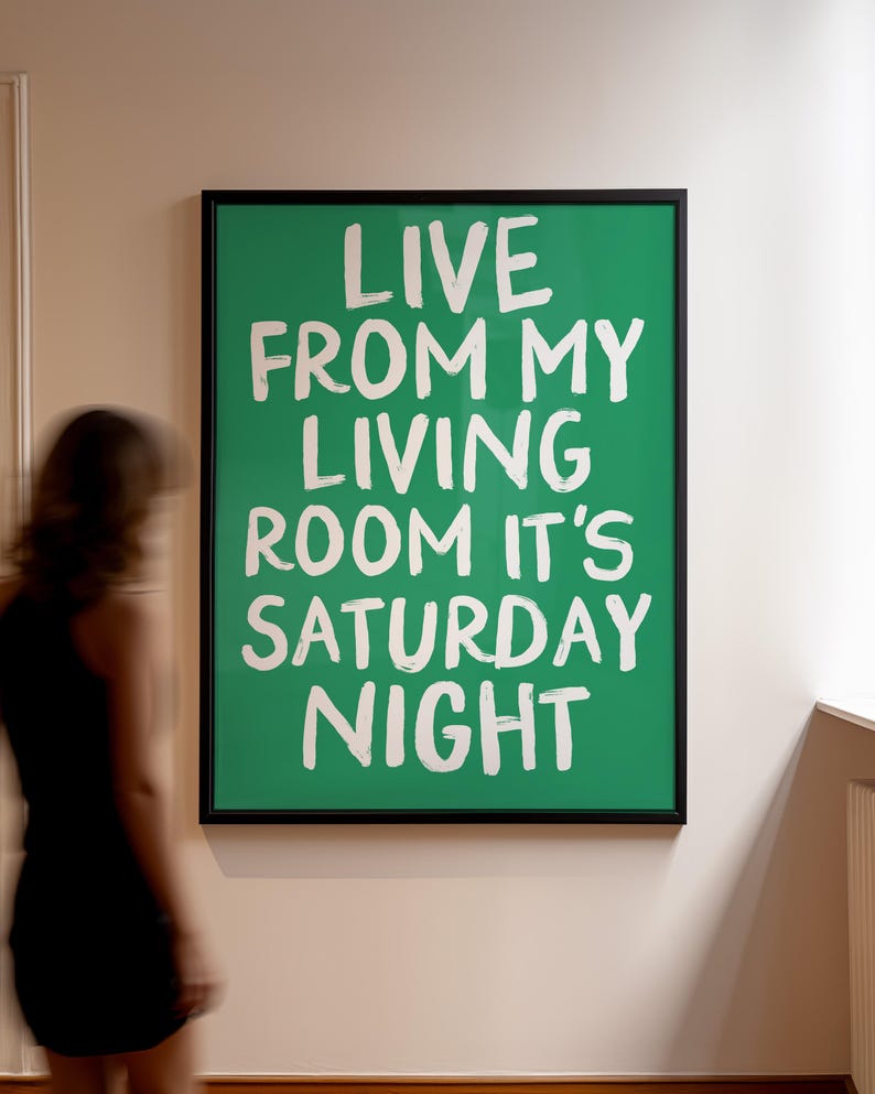 May include: A framed green poster with white text that reads "Live from my living room it's Saturday night".