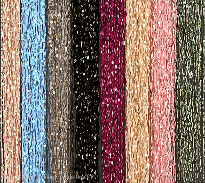 May include: A collection of beaded strands in various colors, including pink, blue, black, and gold. Each strand is adorned with small, reflective sequins, creating a shimmering effect. The strands are arranged vertically, showcasing the diverse color palette.